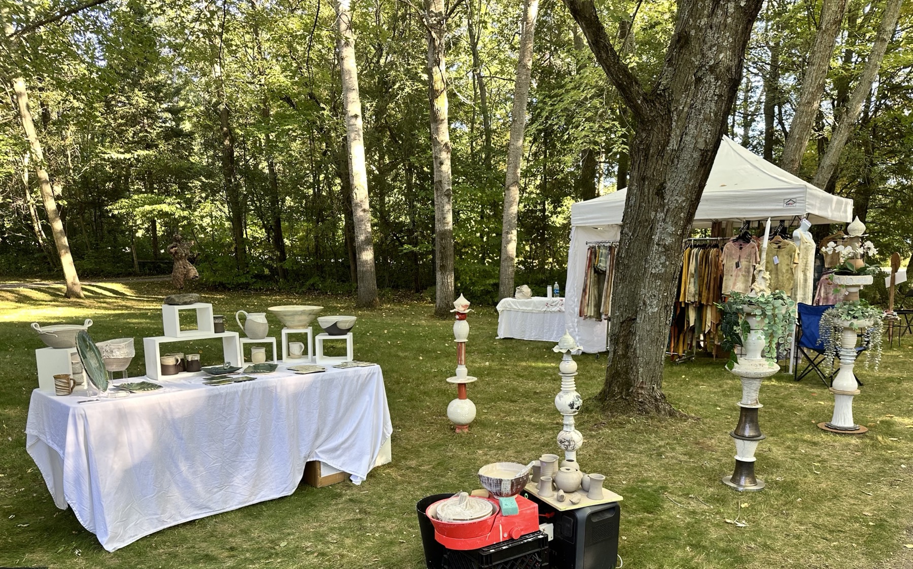 Catharina Goldnau ceramics display at the Uxbridge Studio Tour — outdoor garden setting with ceramic totems and bowls